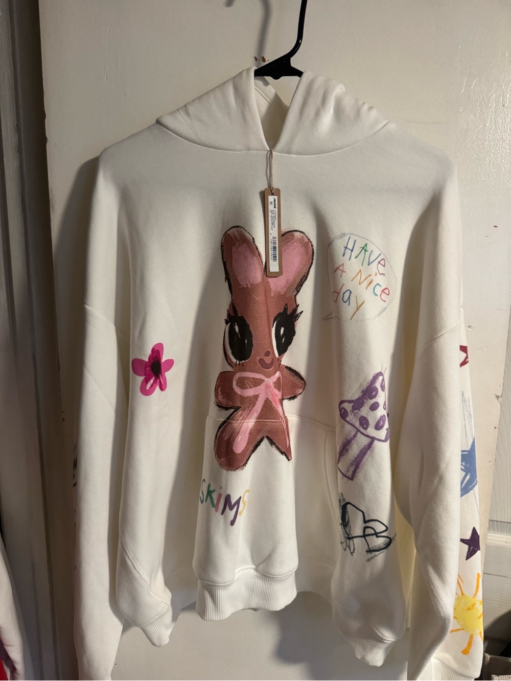 SKIMS Cream Hoodie with Pink Bunny Graphic